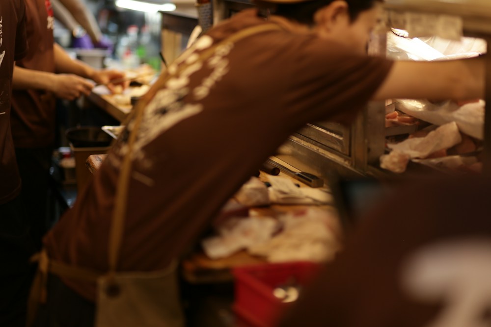 A kitchen team preparing food for service